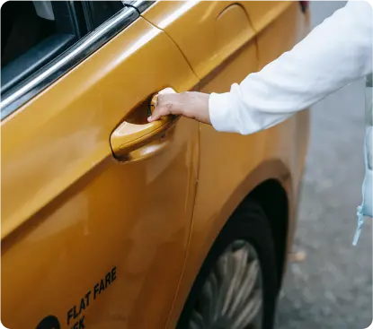 A person opening a car's door